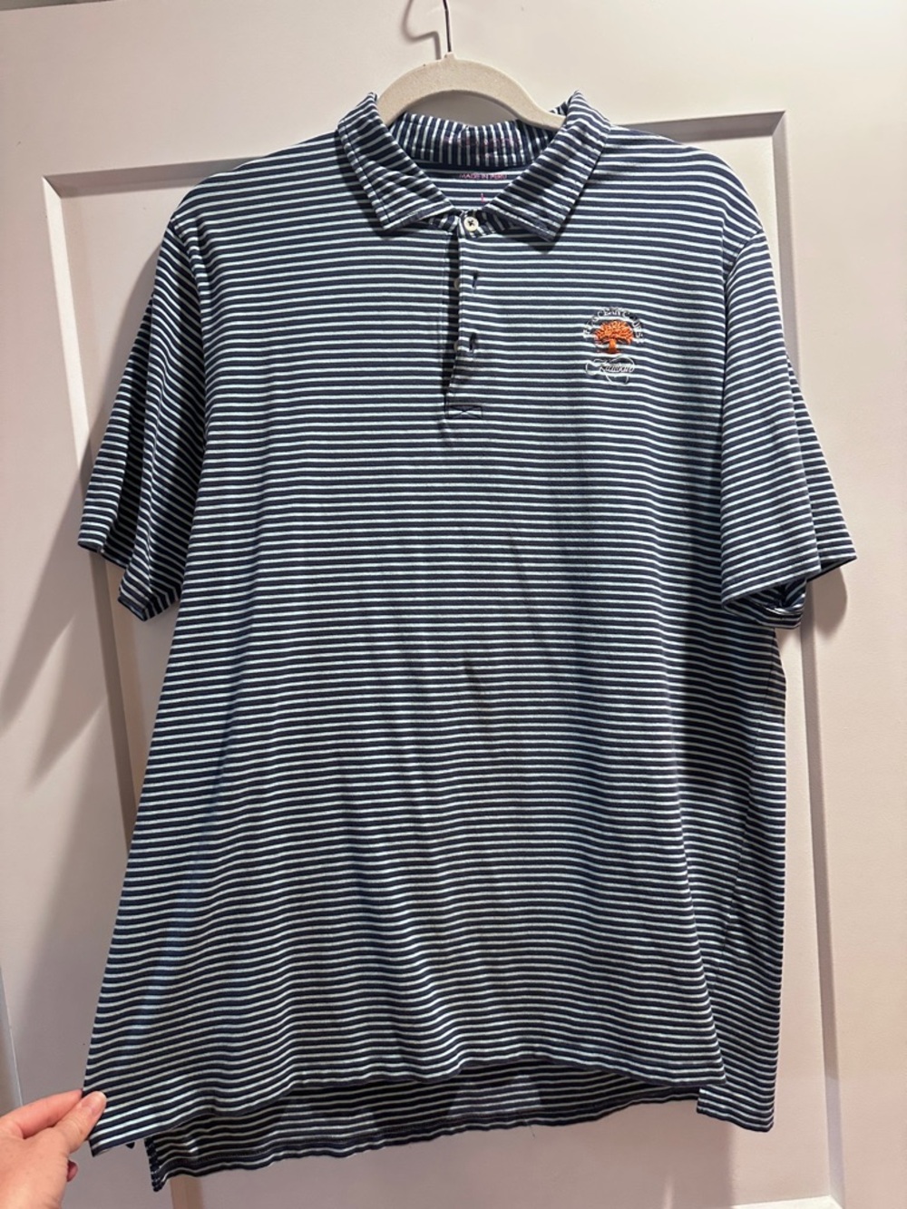 Striped Navy & White Polo with Subtle Chest Emblem